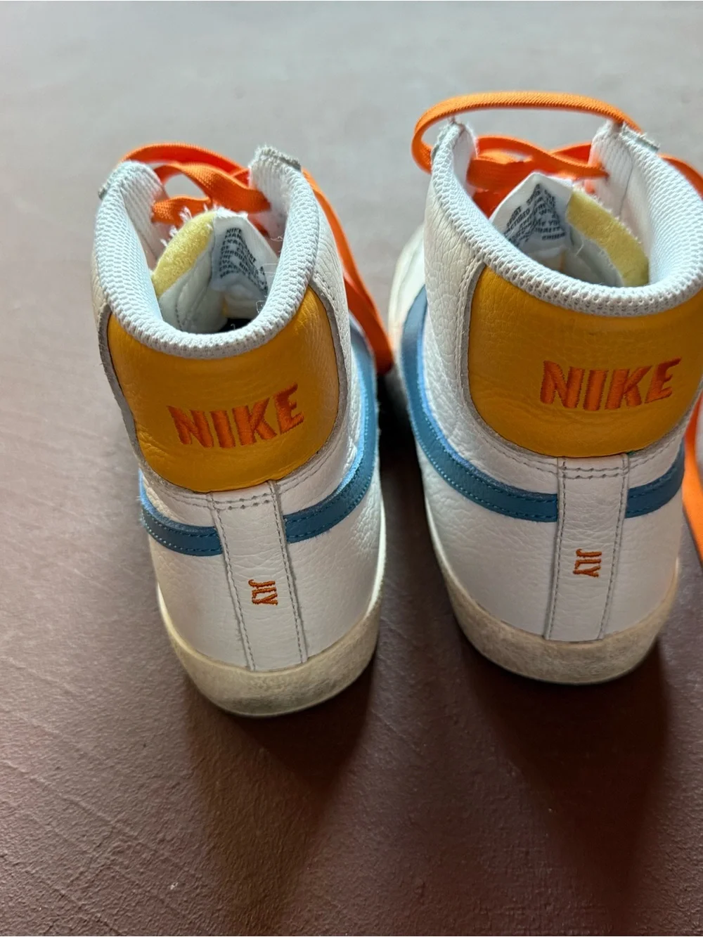 Custom Nike White High-Top Sneakers with Orange Laces and Blue Swoosh